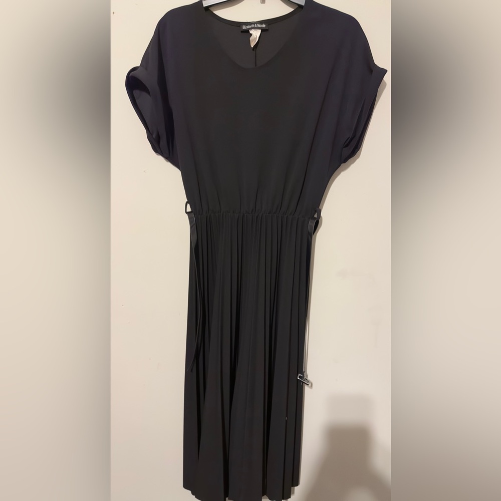 Black pleated dress with belt.